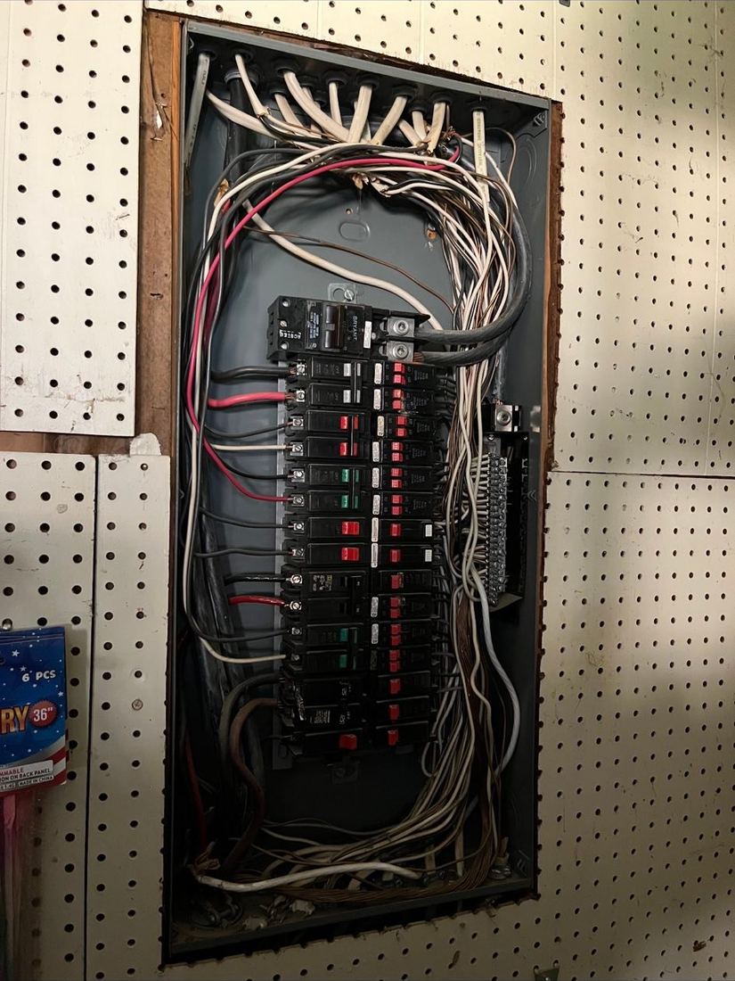 Old interior panel with tangled wiring